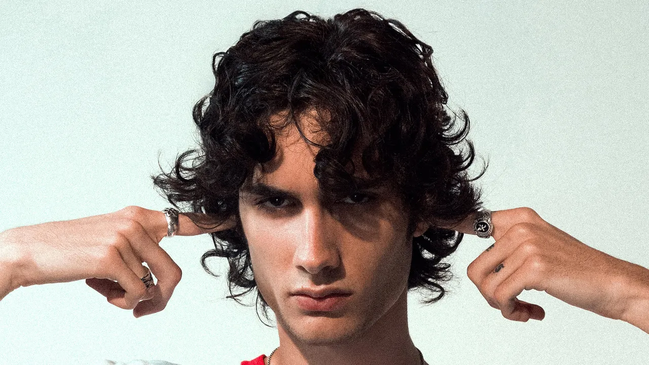 Sombr plugging his ears on the official album cover art for his 2026 debut album I Barely Know Her.